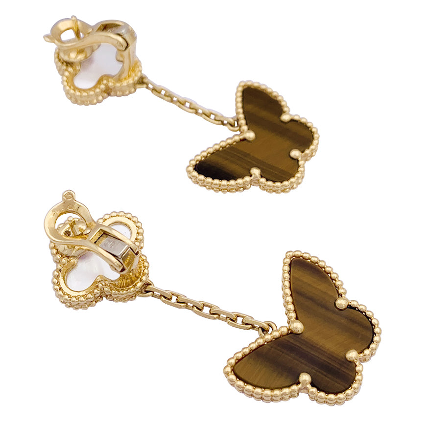 Van Cleef & Arpels "Lucky Alhambra" earrings in yellow gold, white mother-of-pearl, tiger's eye.