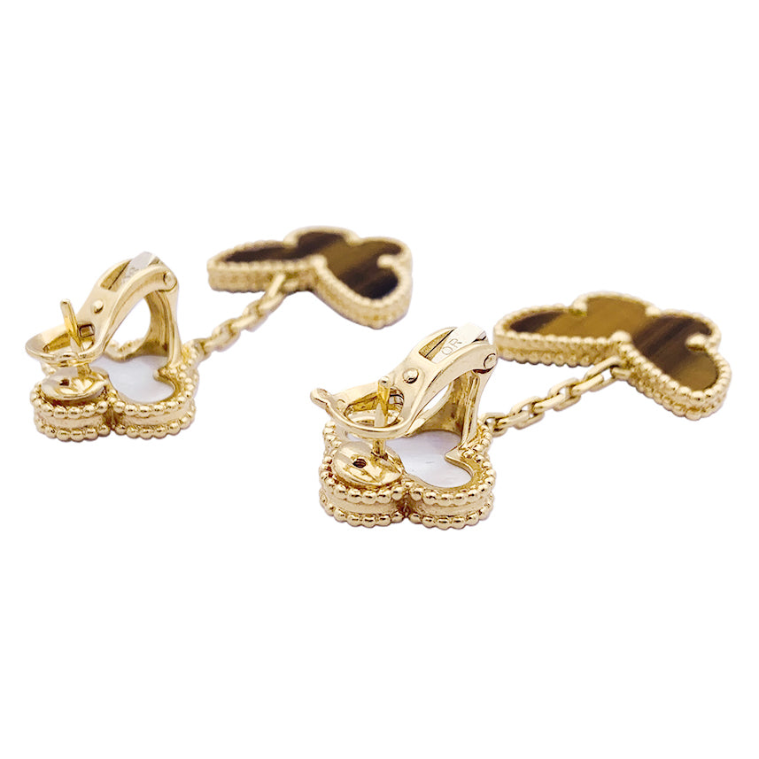 Van Cleef & Arpels "Lucky Alhambra" earrings in yellow gold, white mother-of-pearl, tiger's eye.