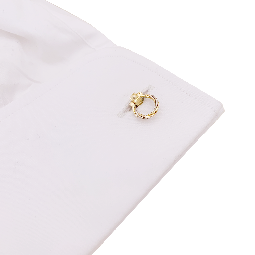 Boutons de manchette Cartier "Trinity", trois ors.