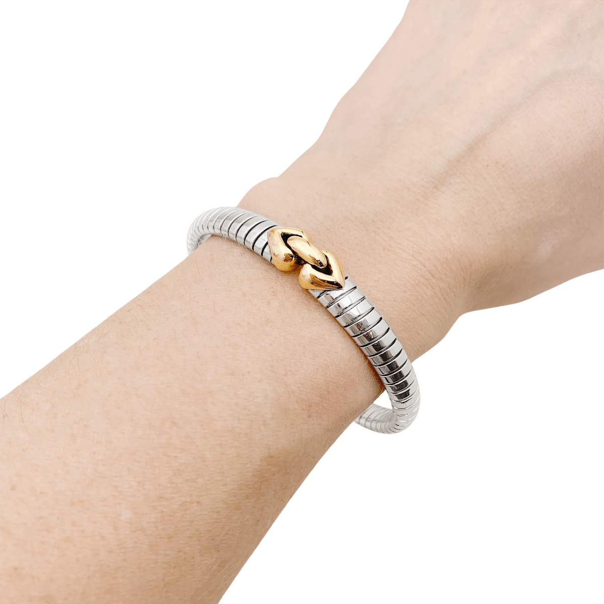 Bracelet Bulgari, "Doppio Cuore", or et acier. - Maison Eloe