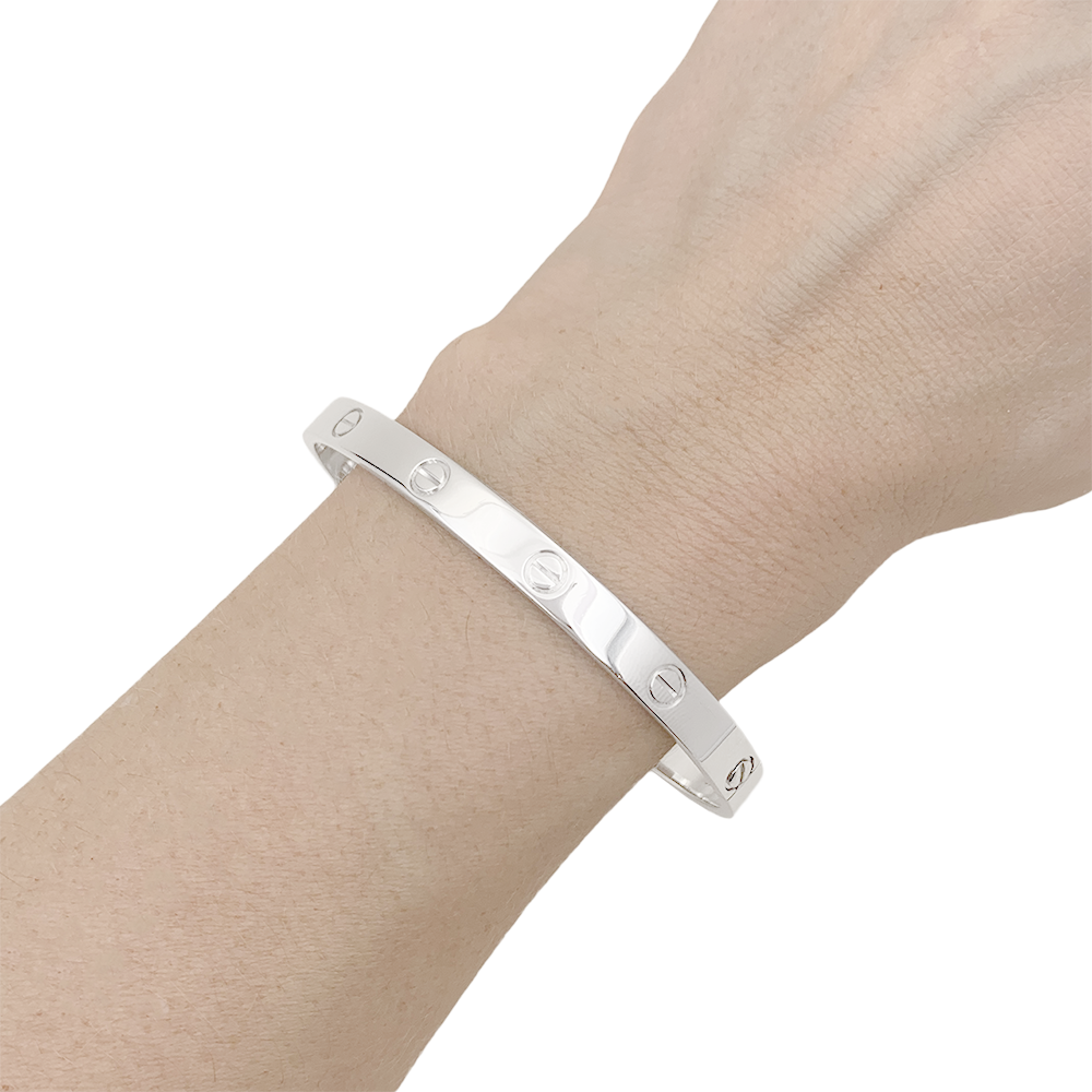 Bracelet Cartier "Love" or blanc.