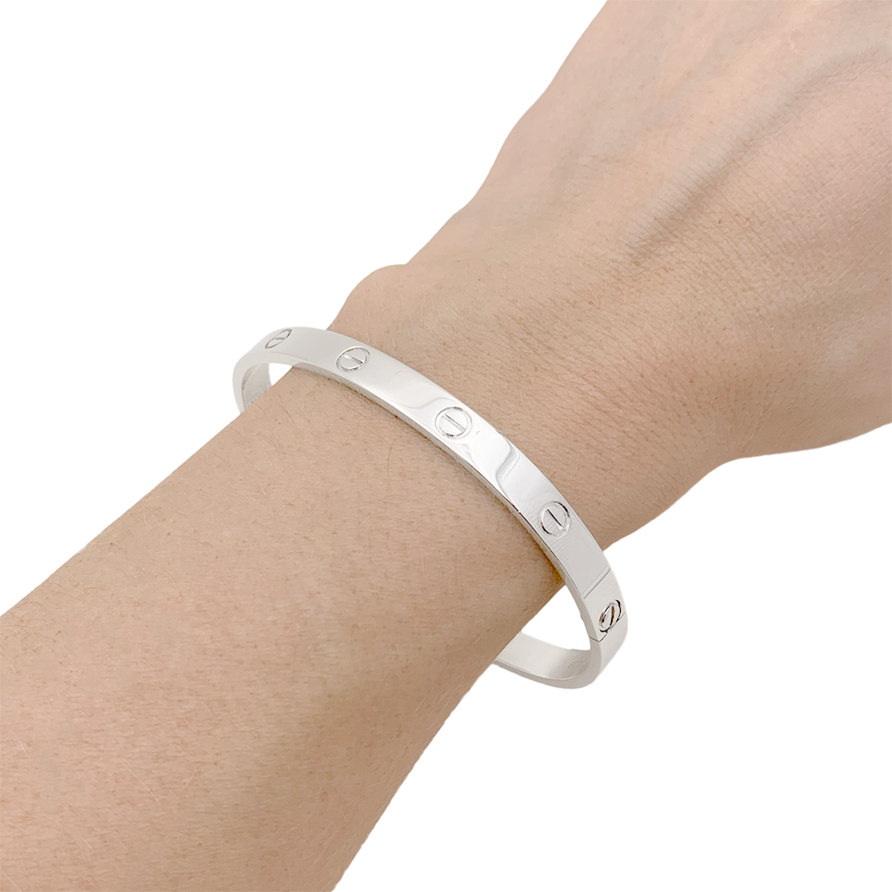 Bracelet Cartier "Love" or blanc.