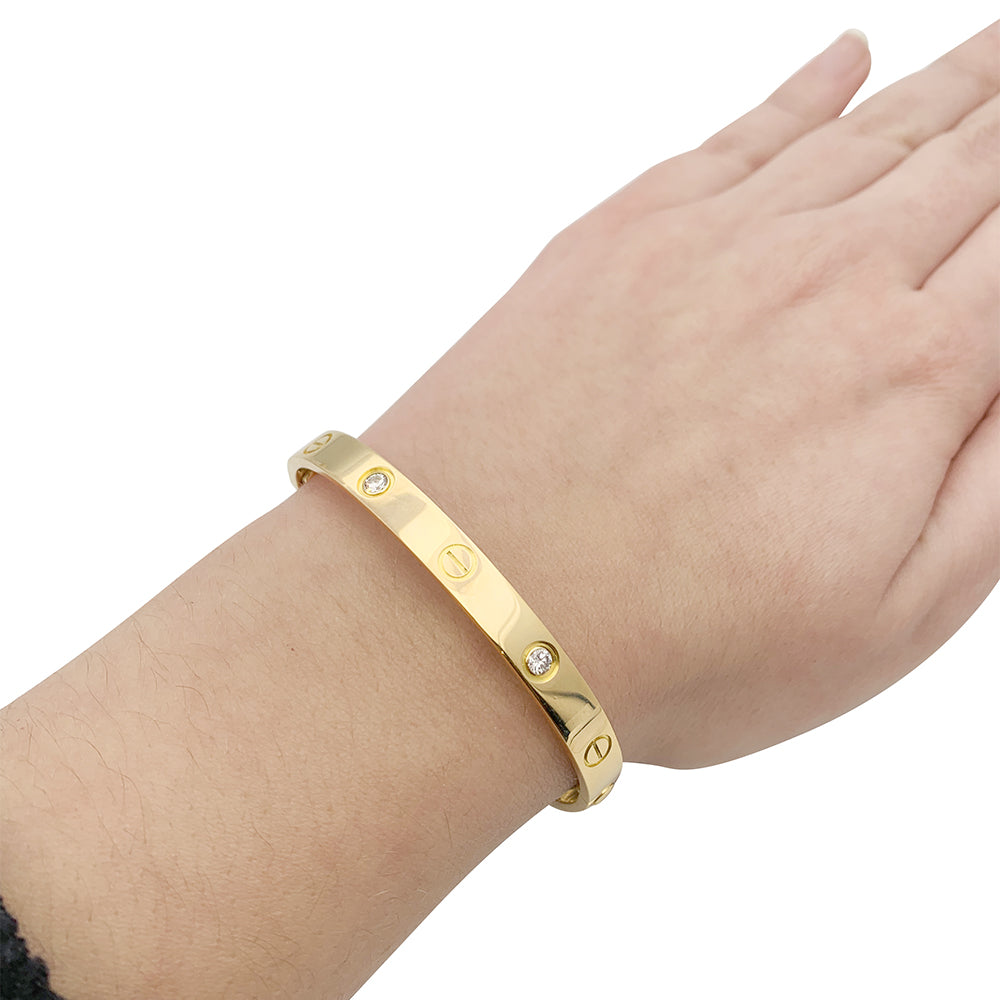 Cartier "Love" bracelet, yellow gold, diamonds.
