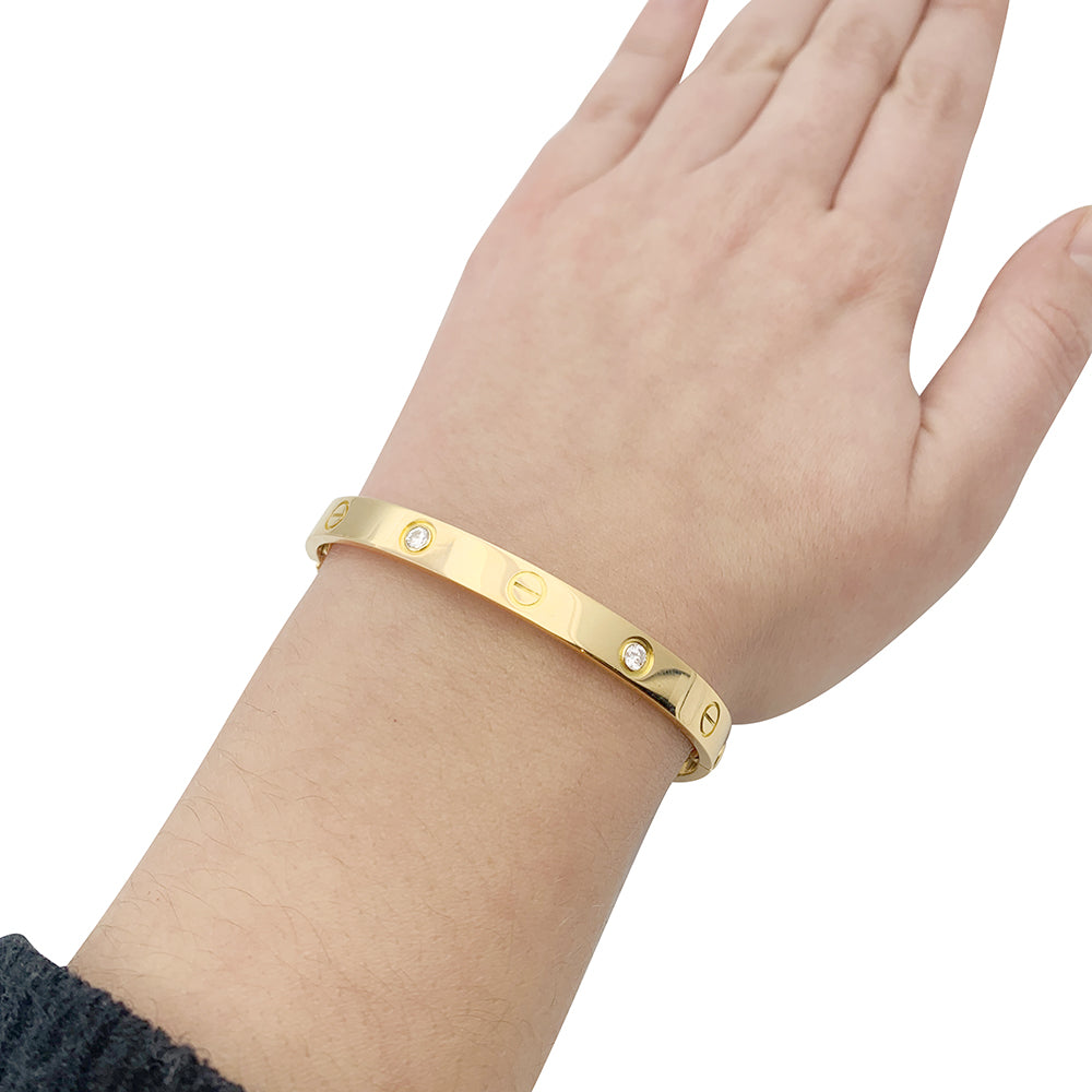 Cartier "Love" bracelet, yellow gold, diamonds.