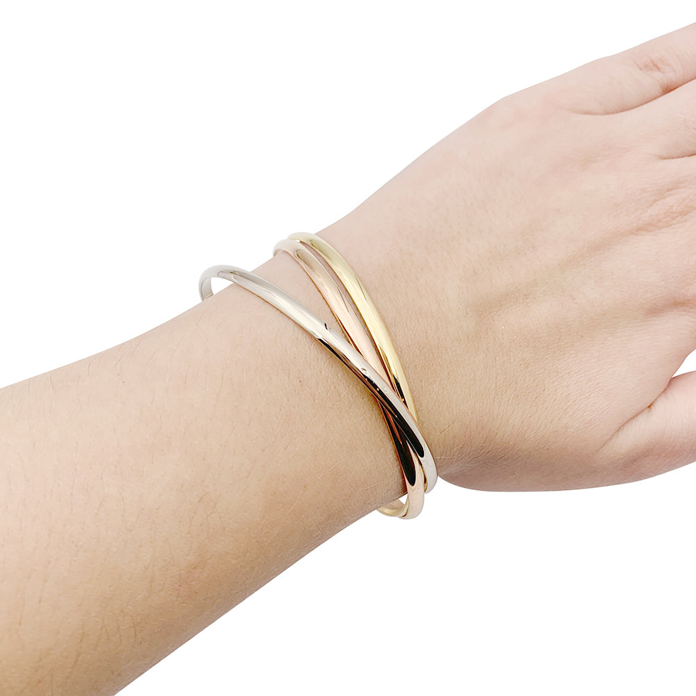 Cartier “Trinity” bracelet in three golds.