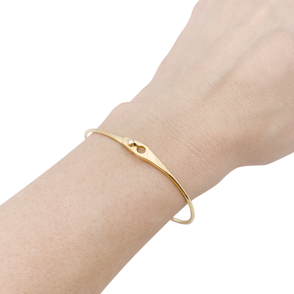 Dinh Van bracelet, "Lock" model in yellow gold, one diamond.