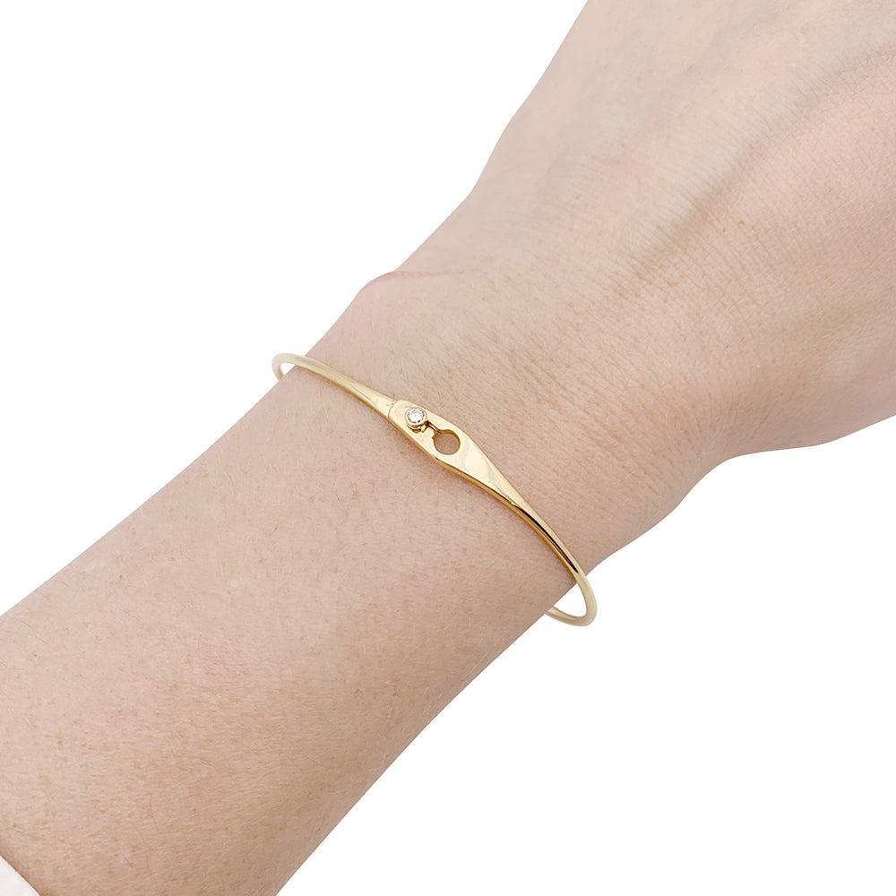Dinh Van bracelet, "Lock" model in yellow gold, one diamond.