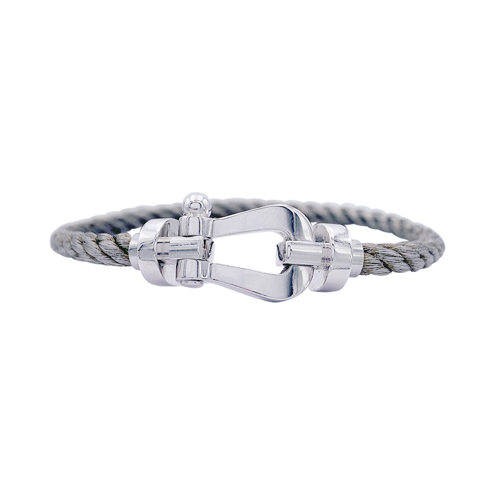 Bracelet Fred, "Force 10", en or blanc et acier.