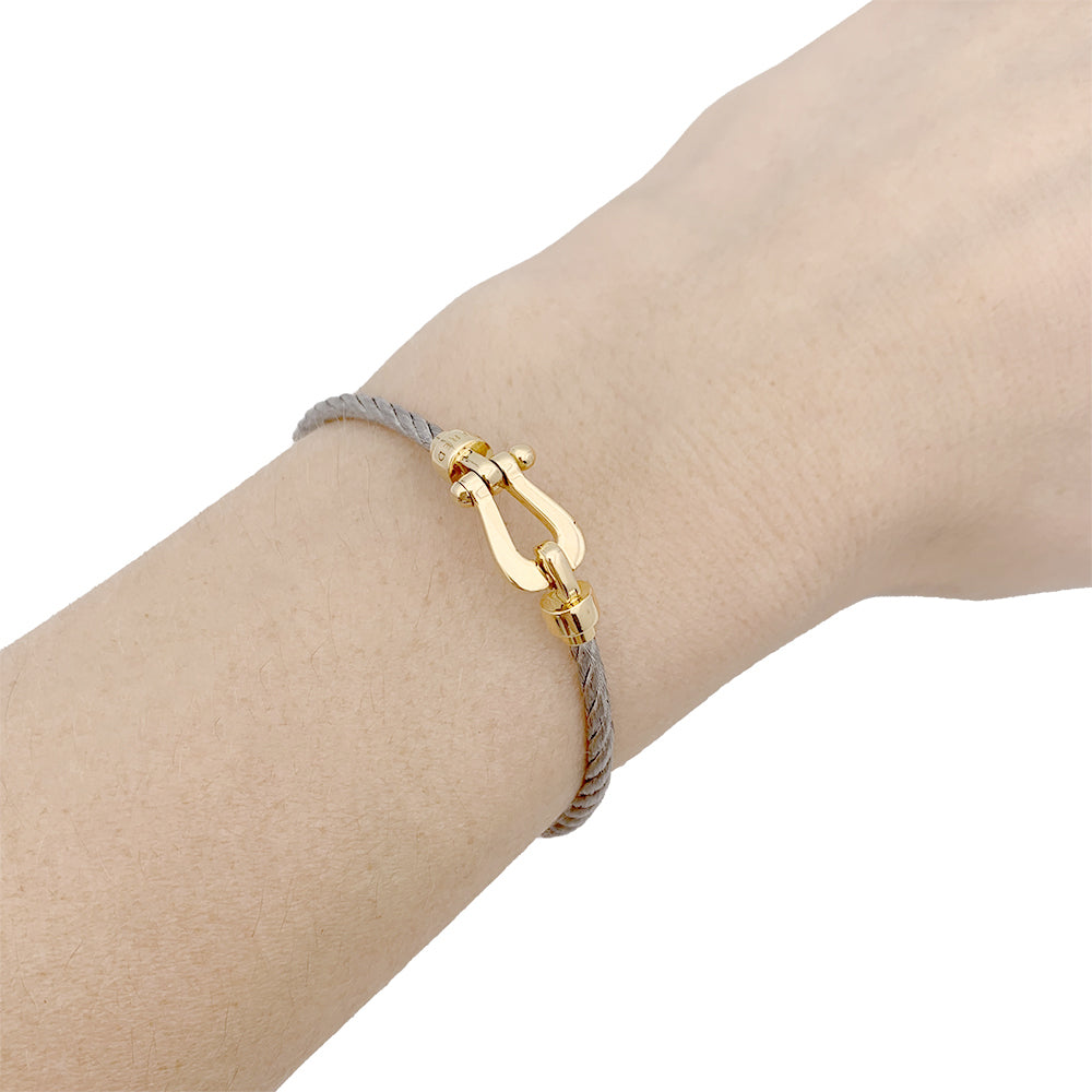 Fred bracelet, "Force 10", yellow gold and steel.