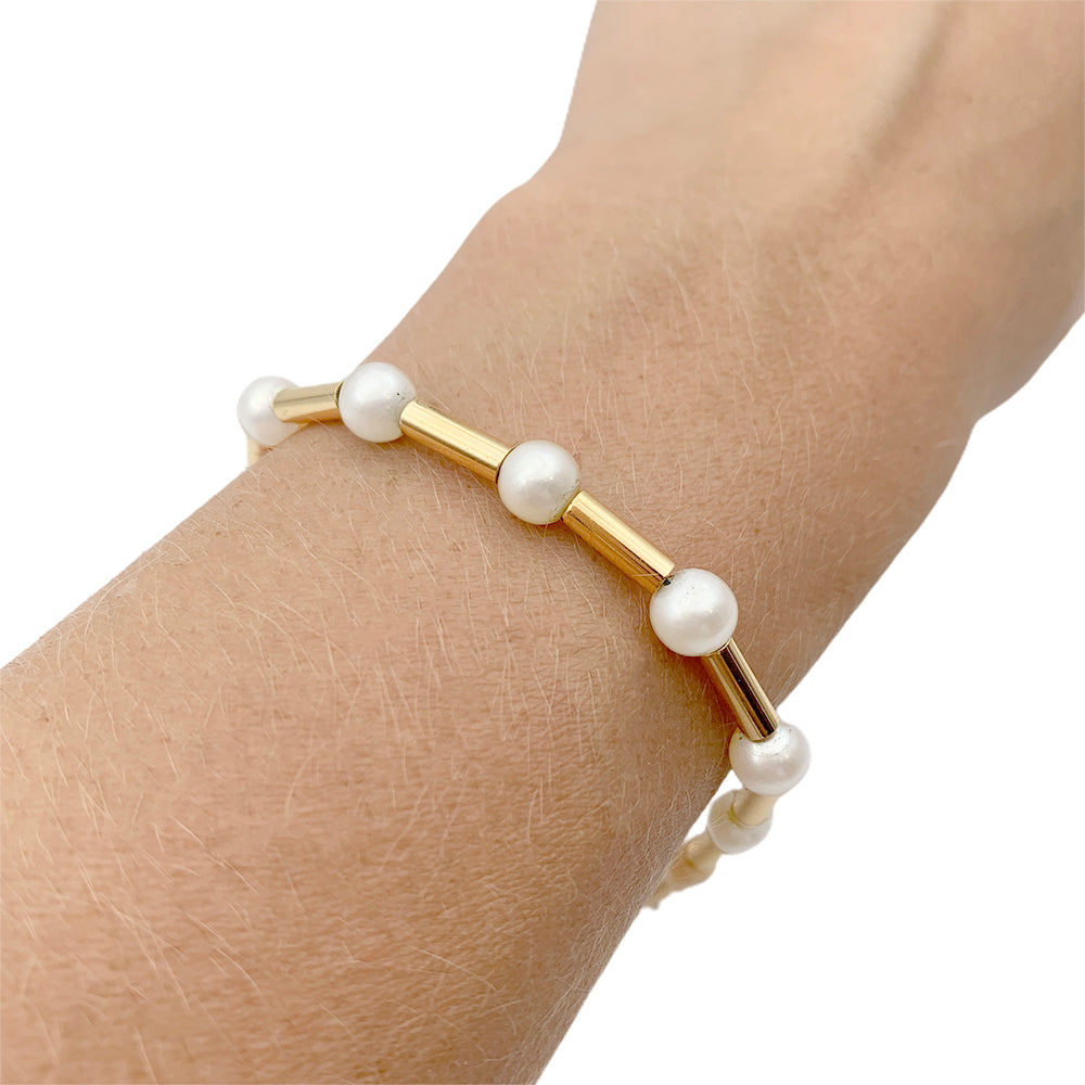 Poiray bracelet, "Roseau", yellow gold and pearls.
