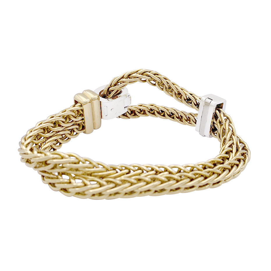 Pomellato bracelet, "Corde", two golds, diamonds.