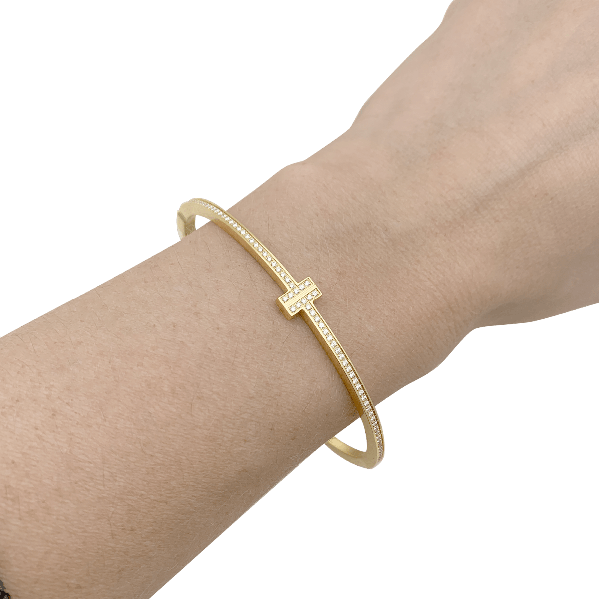 Bracelet Tiffany & Co., "Tiffany T", or jaune, diamants. - Maison Eloe