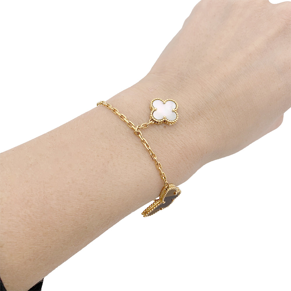 Van Cleef & Arpels "Lucky Alhambra" bracelet in yellow gold with colored stones.