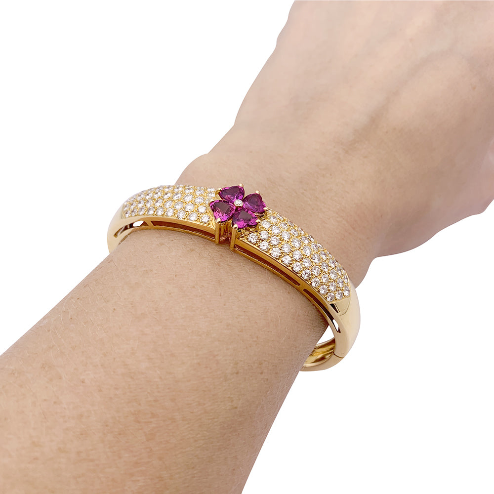Van Cleef & Arpels bracelet in yellow gold, diamonds, pink sapphires.