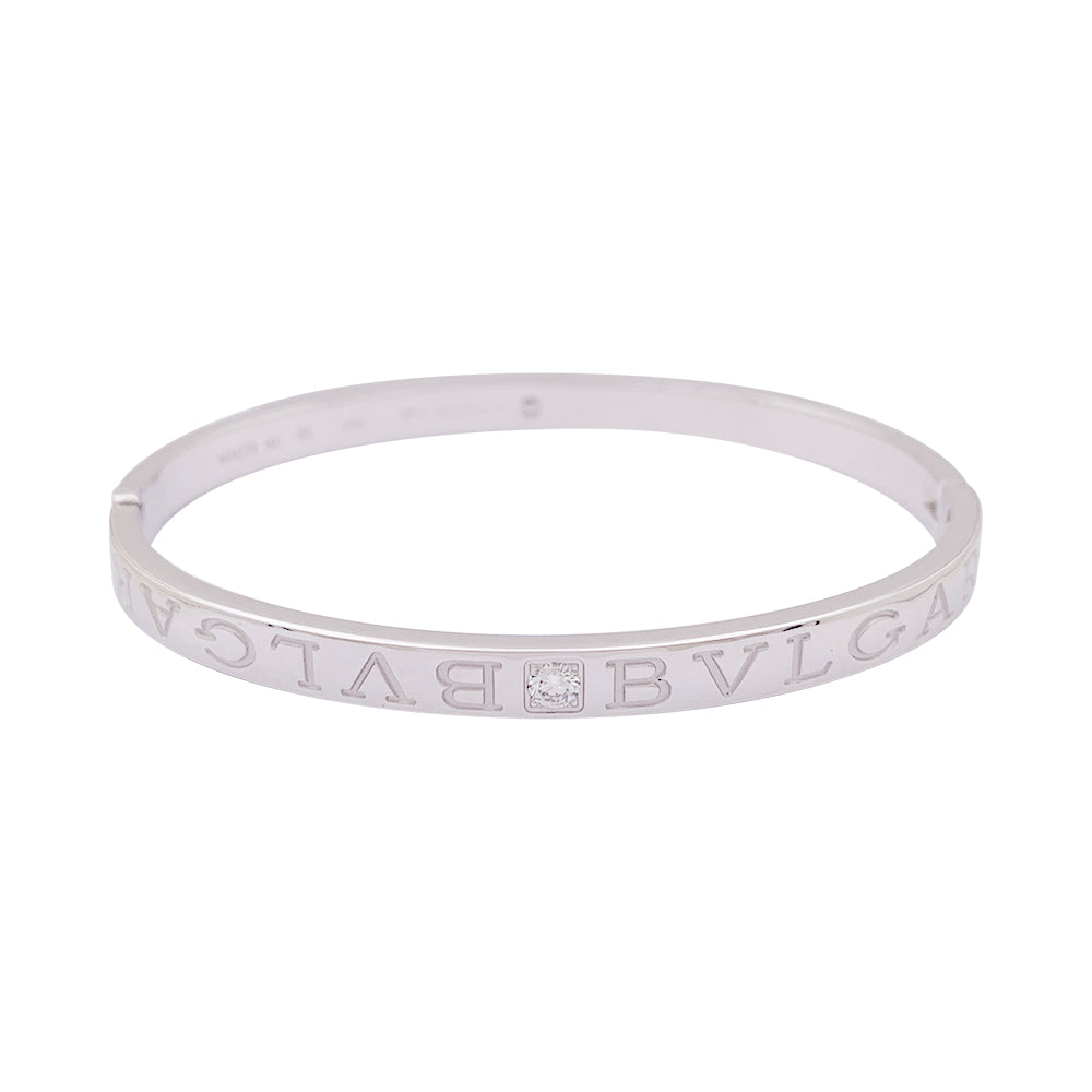 Bracelet jonc Bulgari "Bulgari Bulgari" or blanc, diamants.