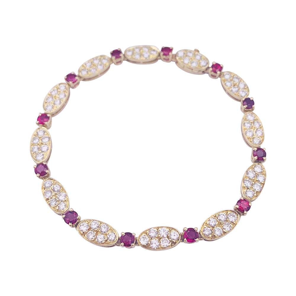 Vintage Van Cleef & Arpels bracelet, diamonds, rubies, yellow gold.