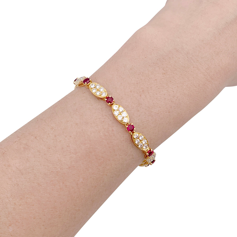 Vintage Van Cleef & Arpels bracelet, diamonds, rubies, yellow gold.
