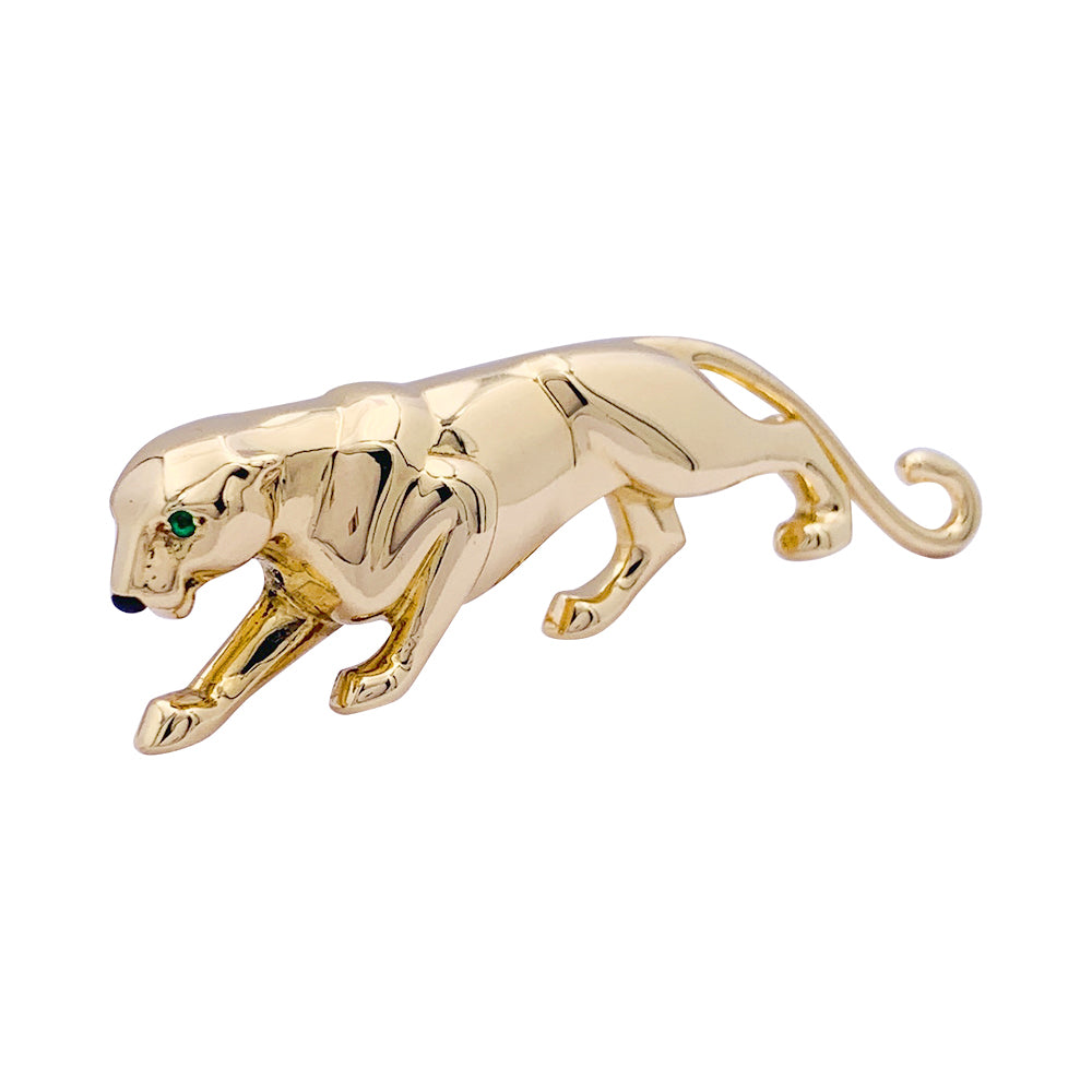 Cartier brooch, "Samantha", yellow gold, emerald and onyx.