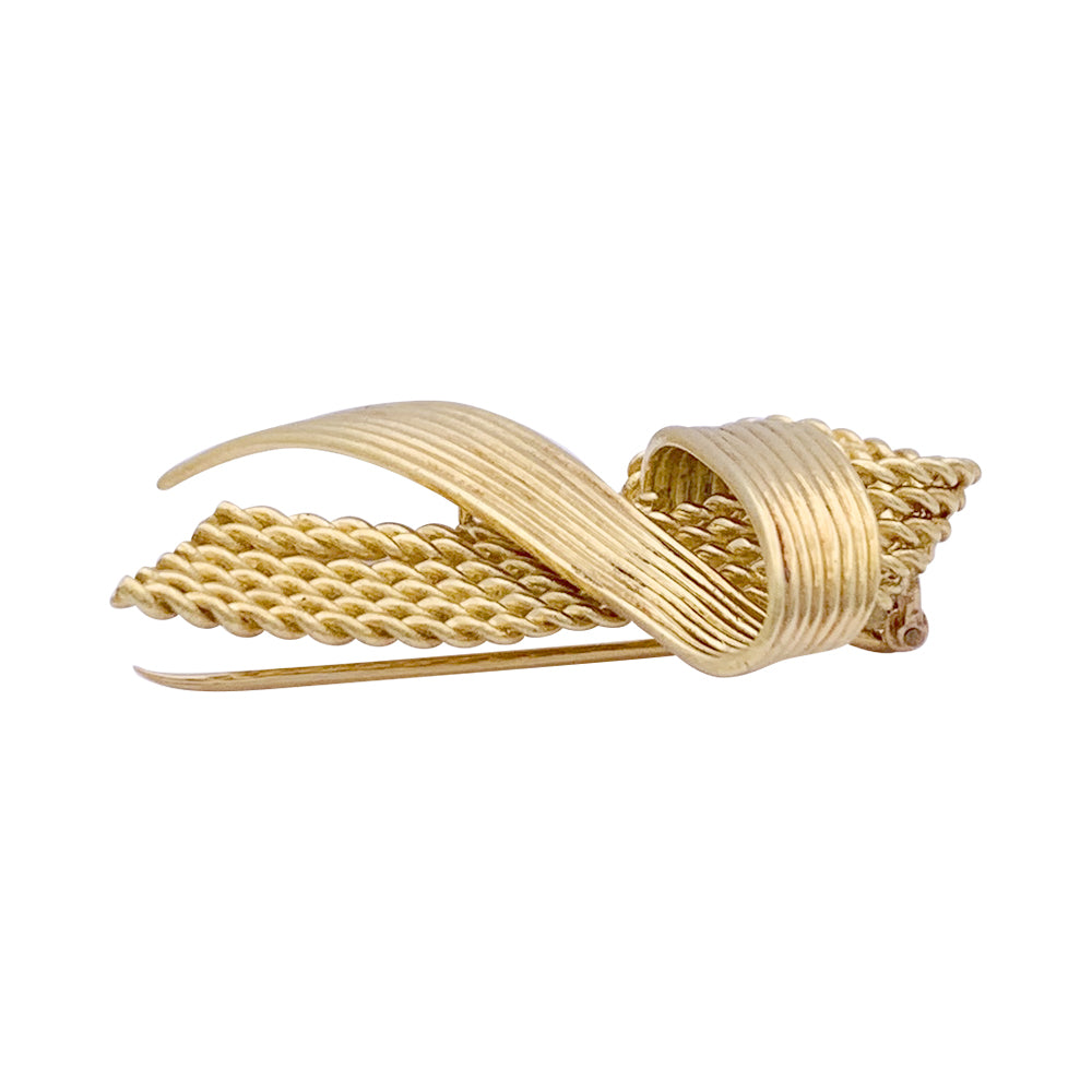 Vintage Mauboussin "Ribbon" brooch, yellow gold.
