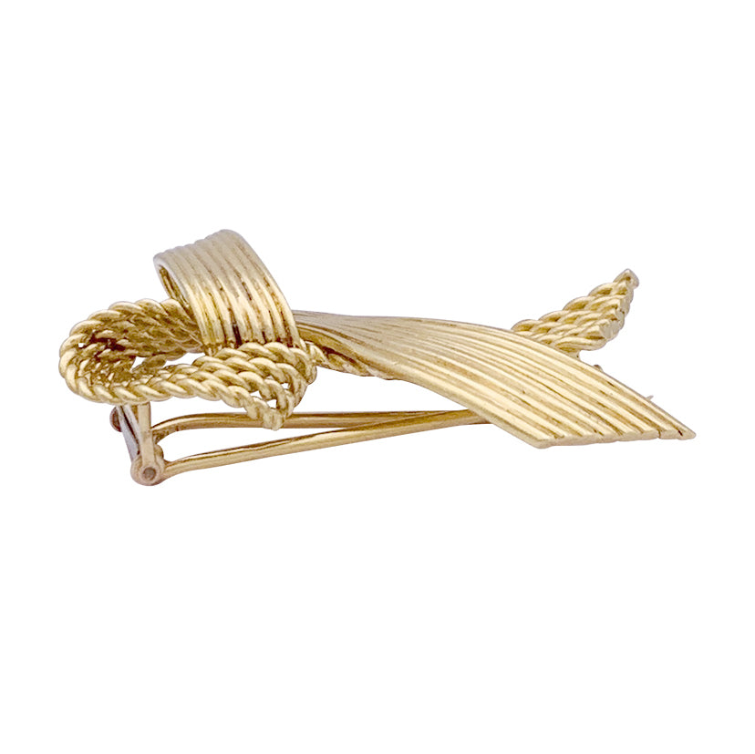 Vintage Mauboussin "Ribbon" brooch, yellow gold.