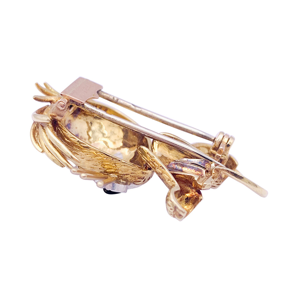 Van Cleef & Arpels brooch, "Ruffled Lion", in yellow gold, diamonds, emeralds and enamel.