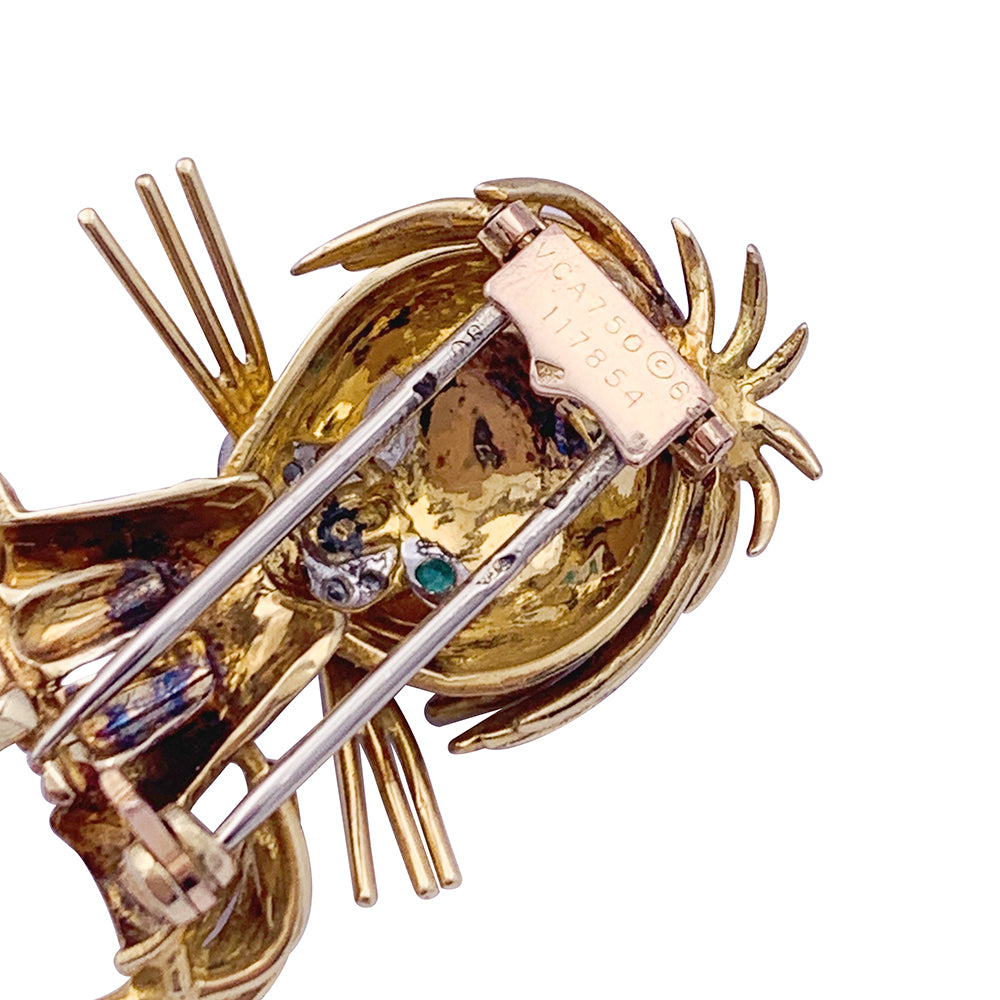 Van Cleef & Arpels brooch, "Ruffled Lion", in yellow gold, diamonds, emeralds and enamel.