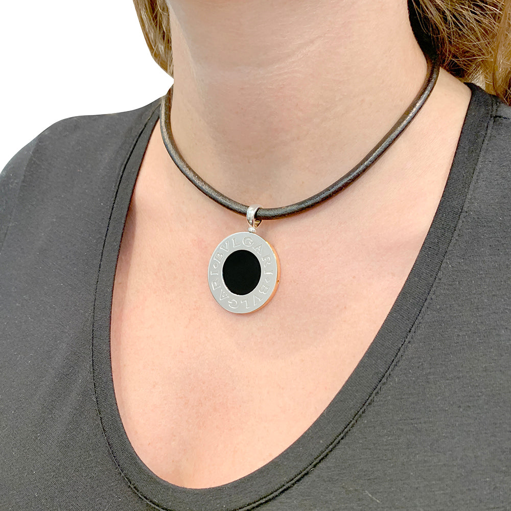 Bulgari "Bulgari Bulgari" necklace in yellow gold, steel, and onyx.