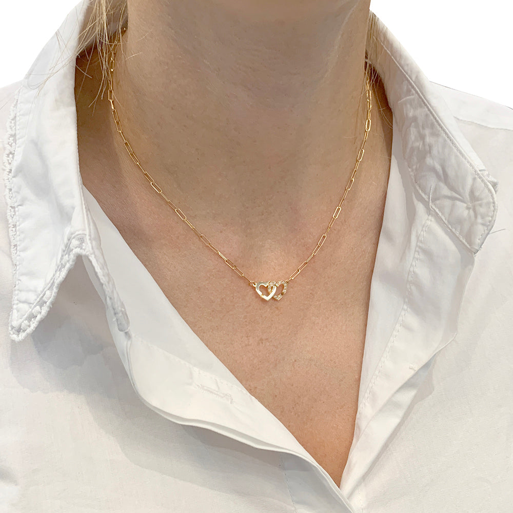 Dinh Van "Double Heart" necklace in rose gold and diamonds.