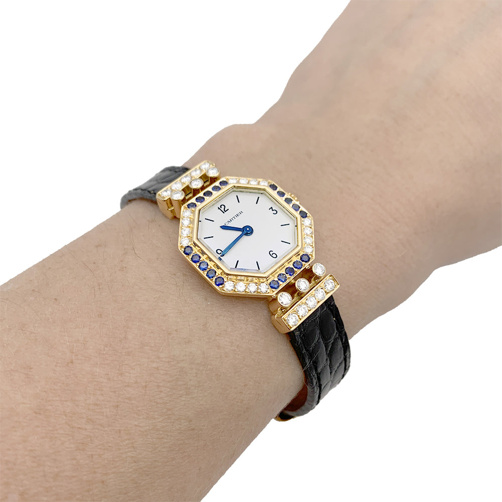 Cartier watch, "Andine", yellow gold, diamonds, sapphires.