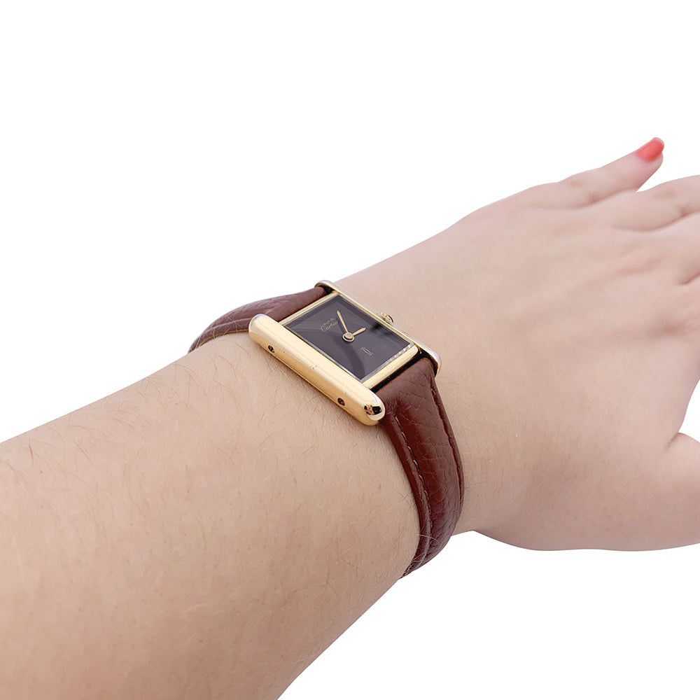 Cartier "Tank Must" watch, gold-plated silver, brown lacquered dial.