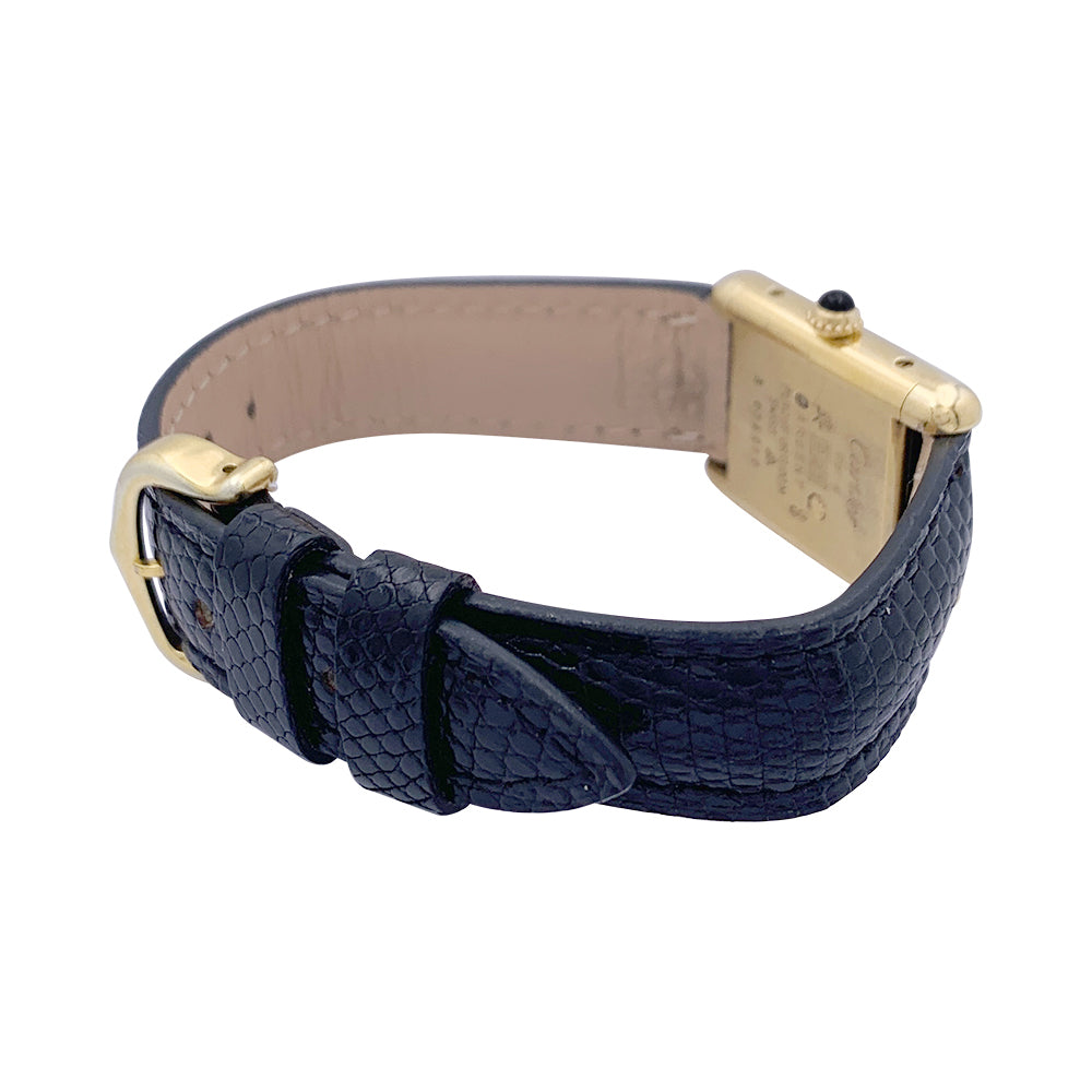 Cartier "Tank Must" watch, gold-plated silver, black lacquered dial.