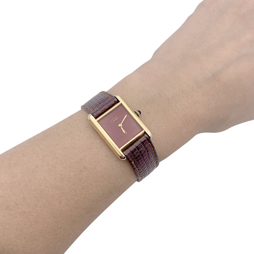 Cartier "Tank Must" watch, gold-plated silver, red lacquered dial.