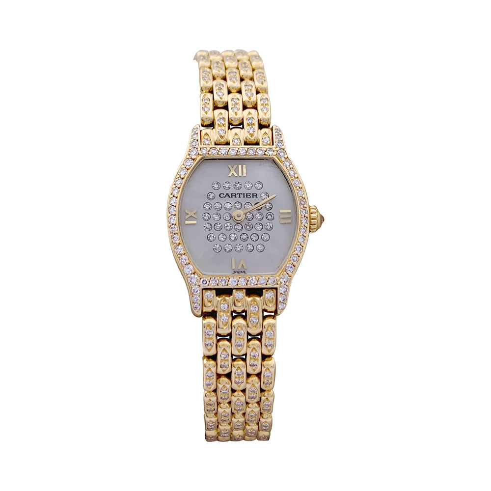 Cartier "Turtle" watch in yellow gold, diamonds, mother-of-pearl.