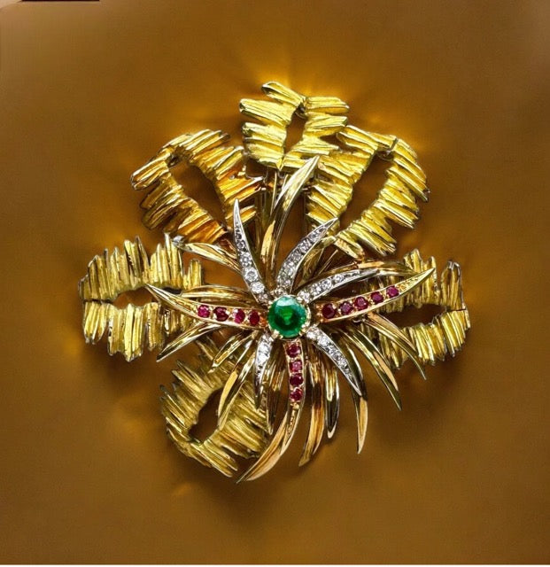 Mellerio 18k yellow gold brooch with emerald, rubies and diamonds