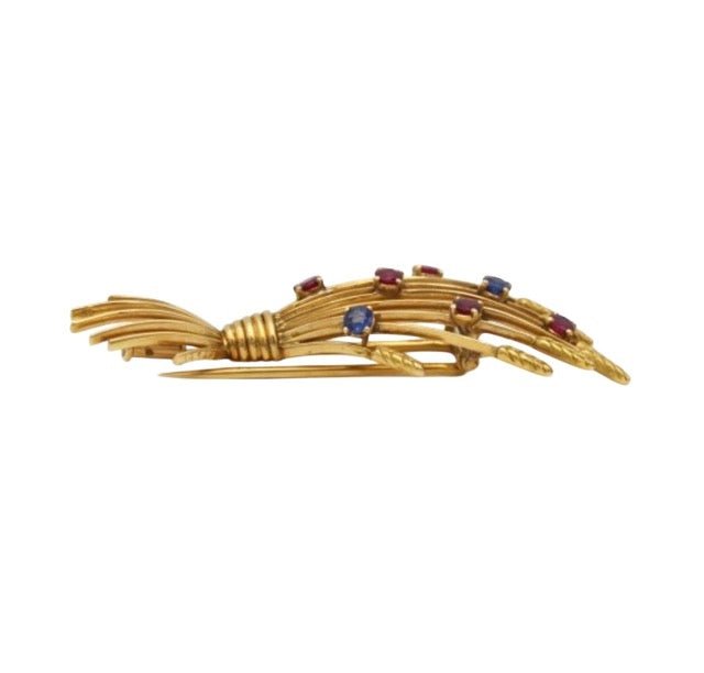 Mellerio, broche vintage en or jaune 18K rubis et saphirs - Maison Eloe
