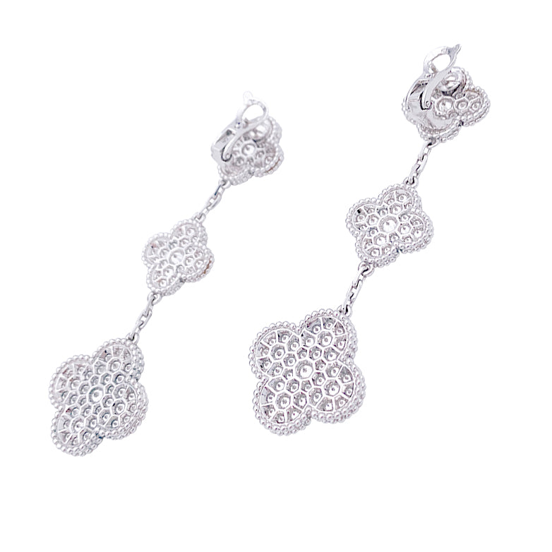 Van Cleef & Arpels "Magic Alhambra" earrings in white gold and diamonds.