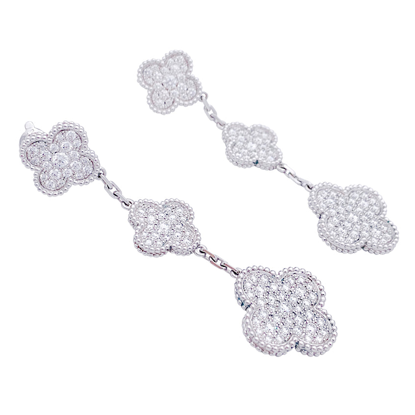 Van Cleef & Arpels "Magic Alhambra" earrings in white gold and diamonds.