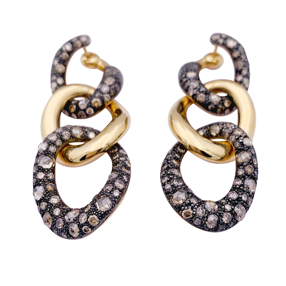 Pomellato "Tango" earrings in rose gold, silver and brown diamonds.