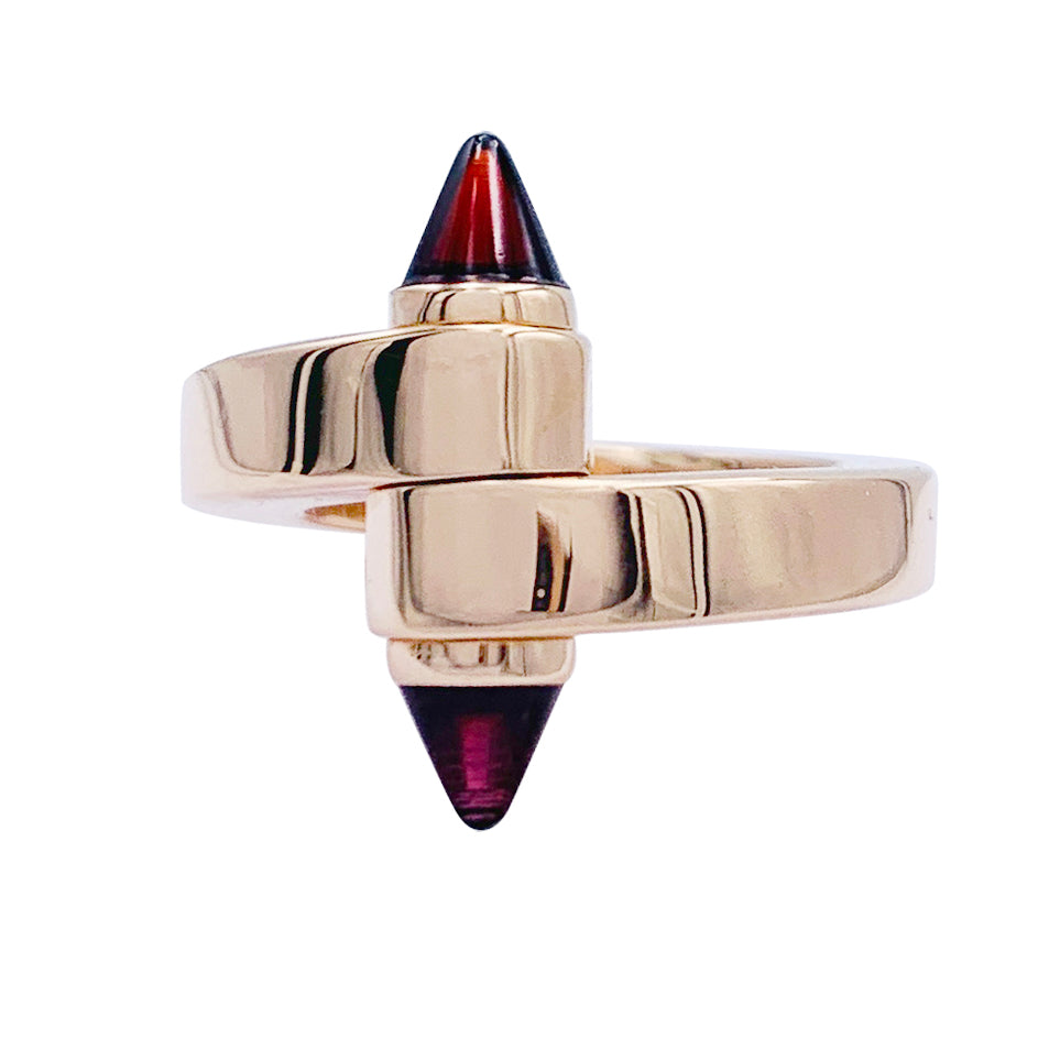 Bague Cartier, "Menottes", or rose, grenats almandins.