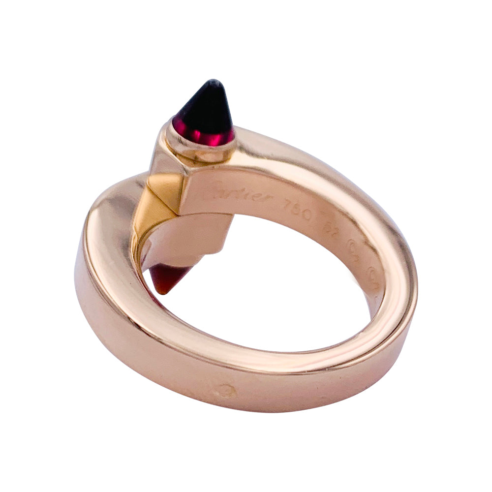 Bague Cartier, "Menottes", or rose, grenats almandins.