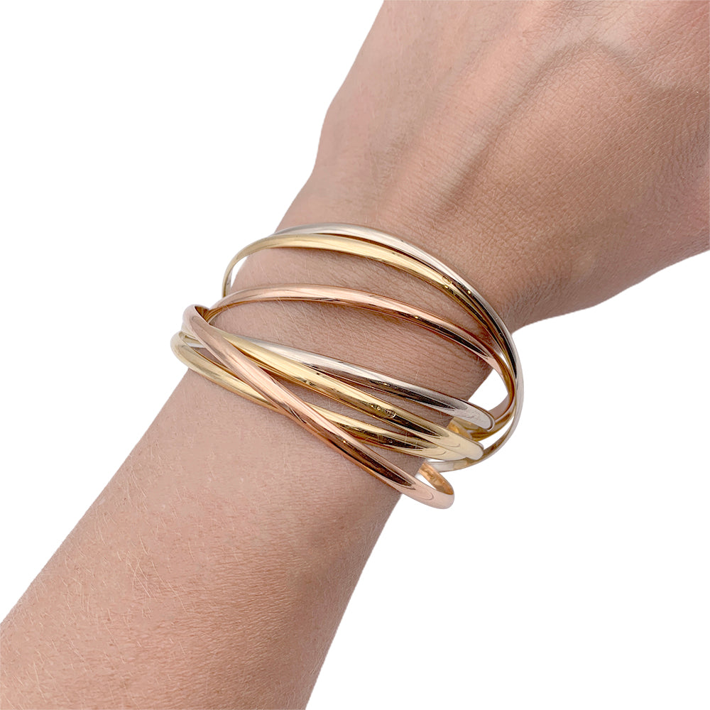 Cartier bracelet, "Trinity Semainier", three golds.