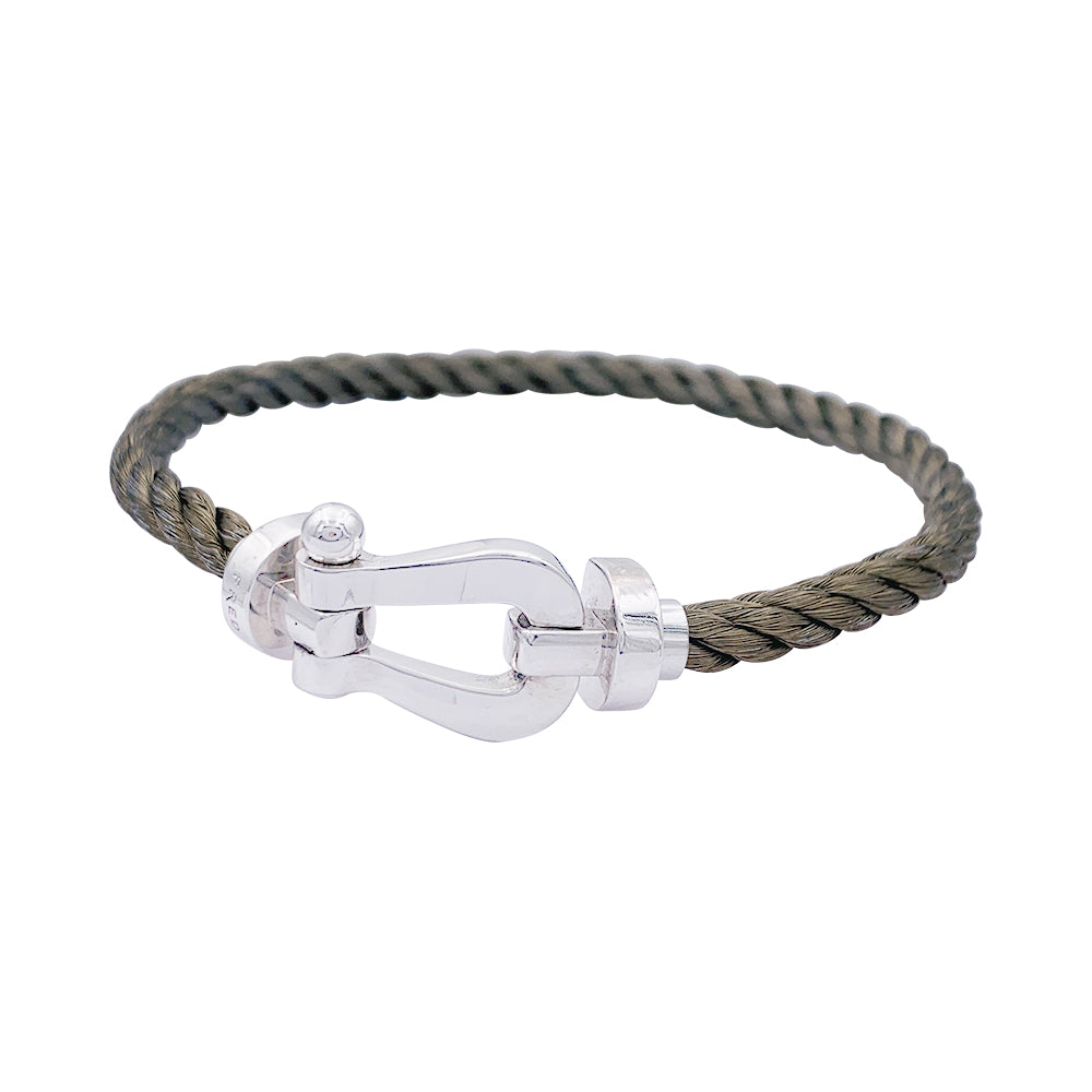 Bracelet Fred,"Force 10", en or blanc et acier.