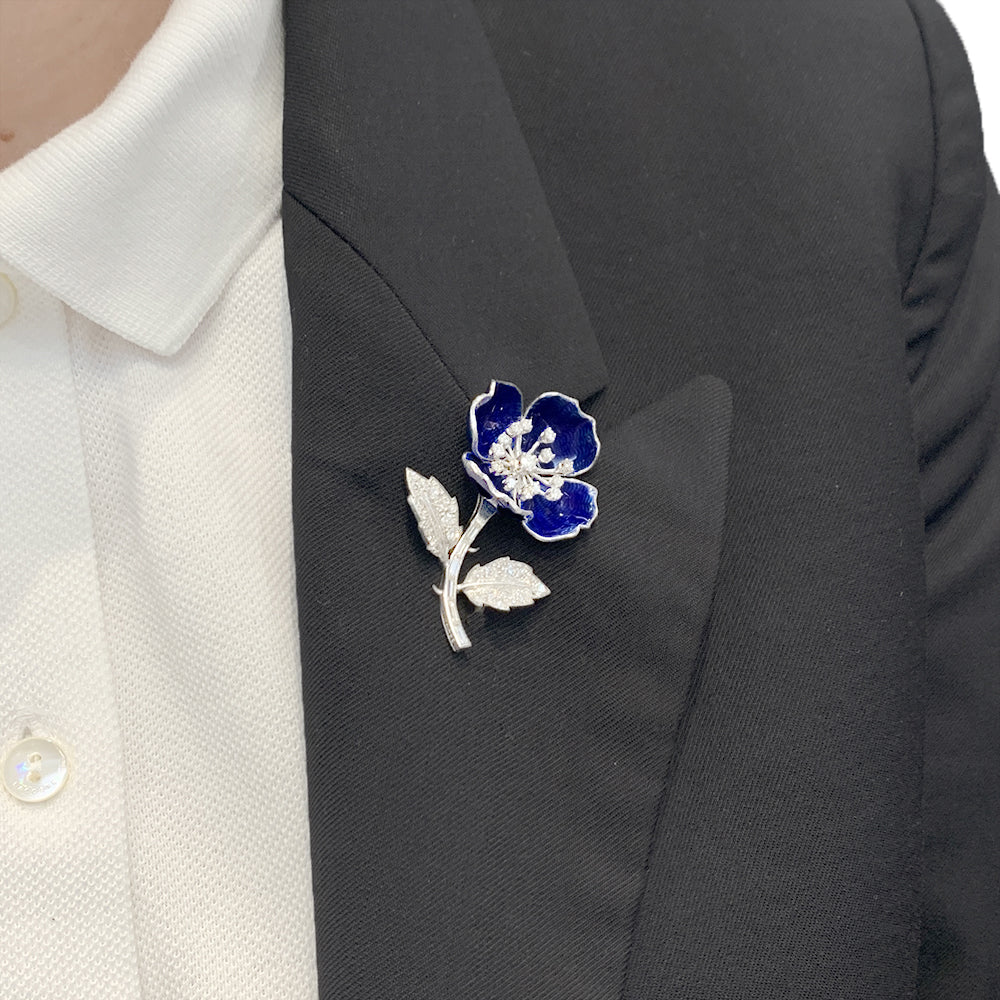 Boucheron clip, "Eglantine", in white gold, platinum, enamel and diamonds.
