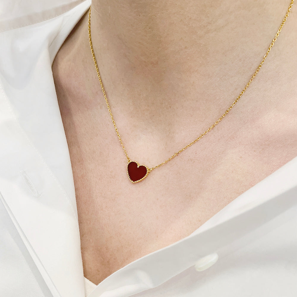 Van Cleef & Arpels necklace, “Lucky Alhambra Heart”, carnelian.