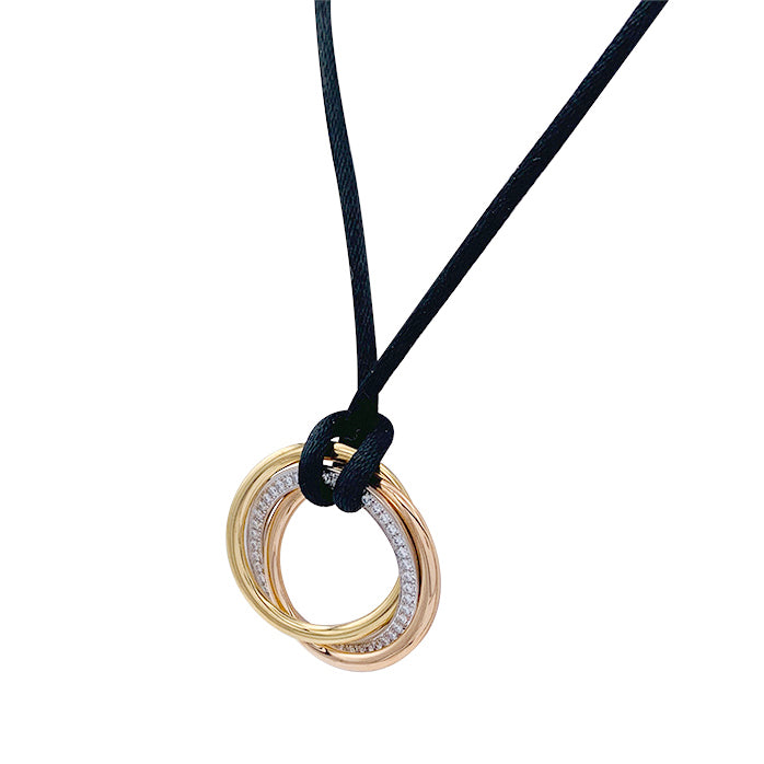 Cartier necklace, "Trinity", three golds, diamonds.