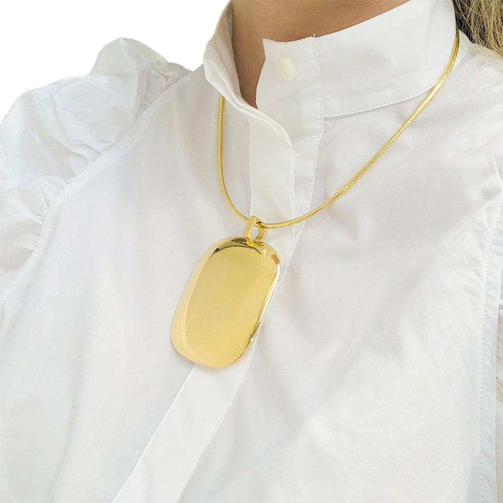 Important Dinh Van yellow gold pendant.