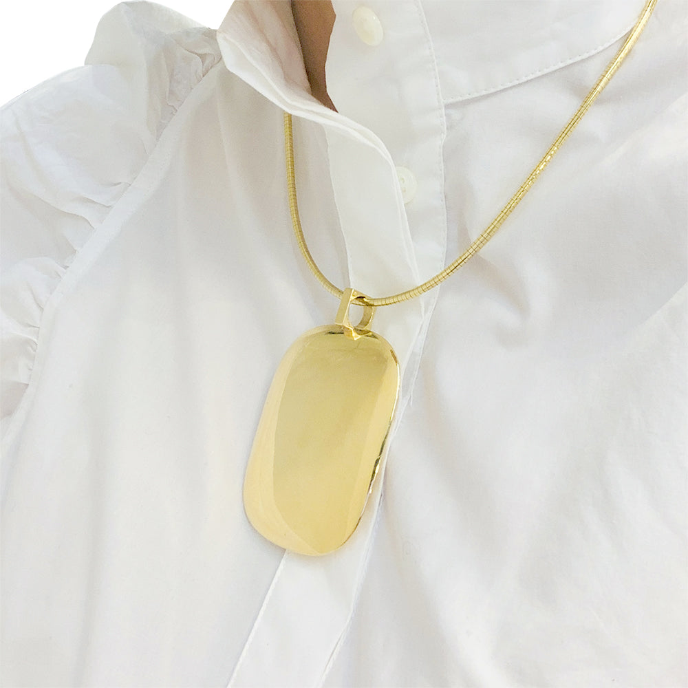 Important Dinh Van yellow gold pendant.