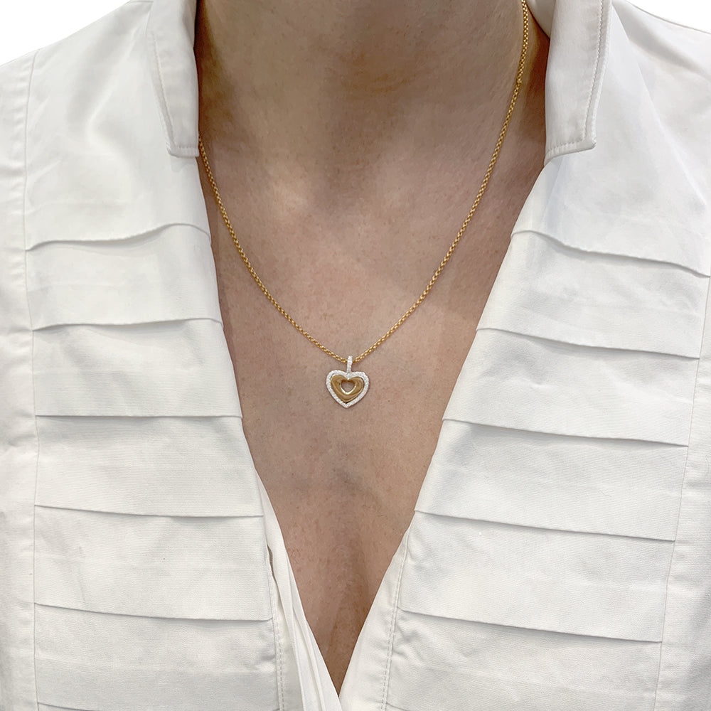 Poiray pendant, "Secret Heart", yellow gold, white gold and diamonds.