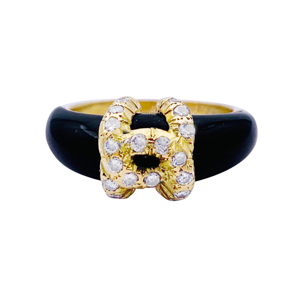 Bague Cartier, "Double C", or jaune, onyx, diamants.
