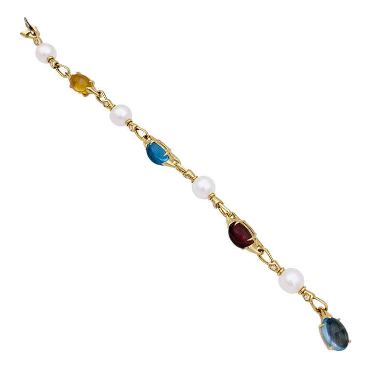 Bulgari bracelet in yellow gold, pearls, colored stones.